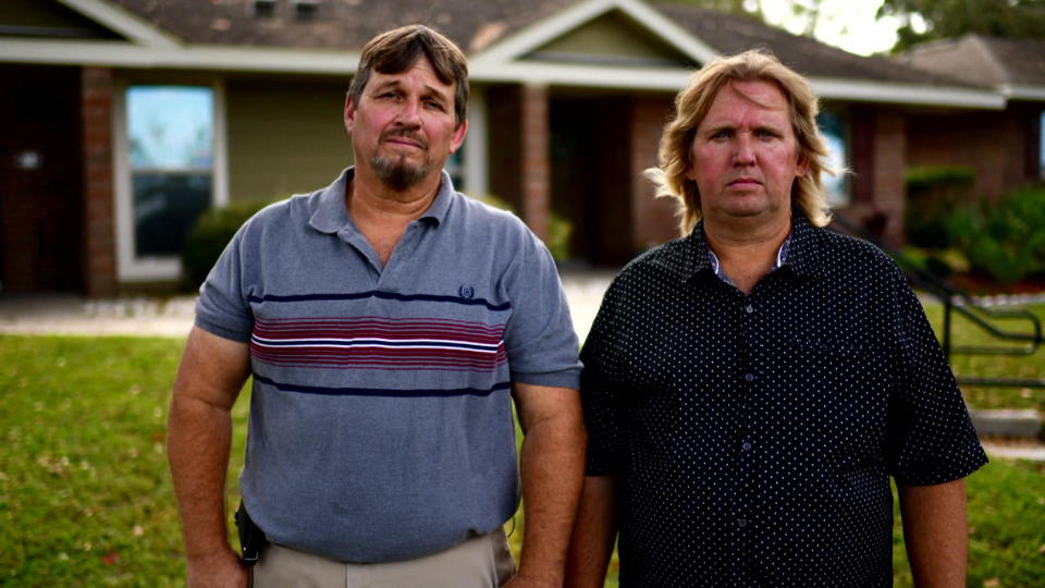 Jeff, left, and Tim Slaten stand outside their former home -- in the spot they say their childhood ended on Sept. 4, 1981   As police hustled the boys outside, Tim says,  
