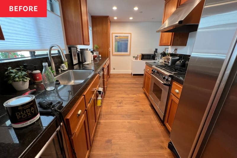 Dark countertops in kitchen before renovation.