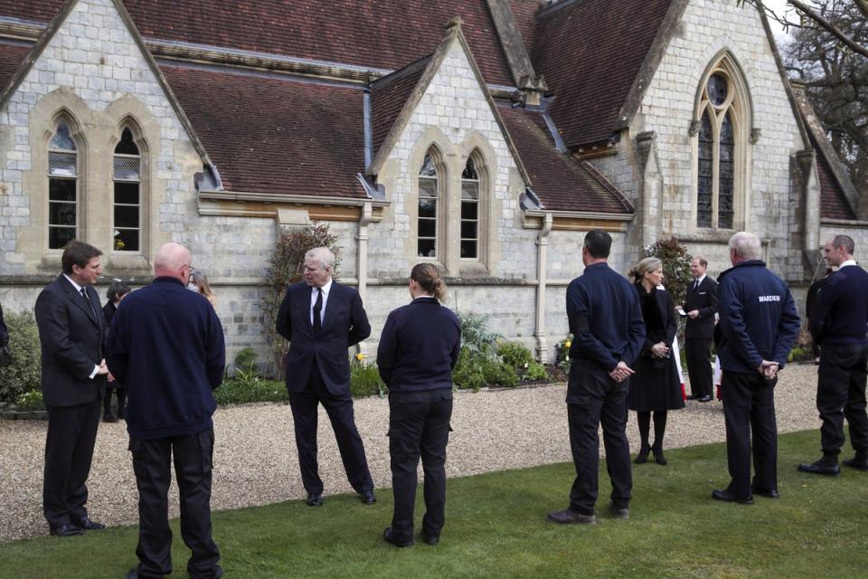 Staff gather outside the Royal Lodge (PA)