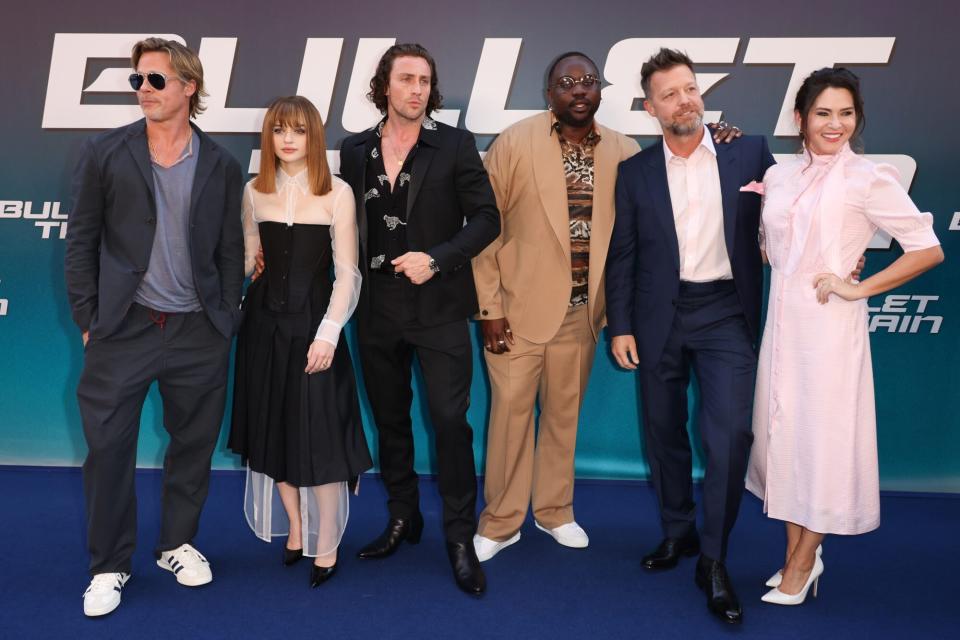 PARIS, FRANCE - JULY 18: Brad Pitt, Joey KIng, Aaron Taylor-Johnson, Brian Tyree Henry, David Leitch and Kelly McCormick attend "Bullet Train" Premiere At Le Grand Rex on July 18, 2022 in Paris, France. (Photo by Pierre Suu/Getty Images)