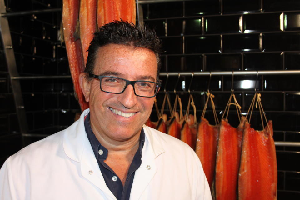 In this Friday, Aug. 16, 2019 photo, Lance Forman, owner of H. Forman & Son, smoked salmon business, poses for a photograph after an interview with the Associated Press Television News. Lance Forman's family has been producing traditional smoked salmon in London for four generations and supply some of London's finest restaurants, hotels and stores. (AP Photo/Steven Pollock)