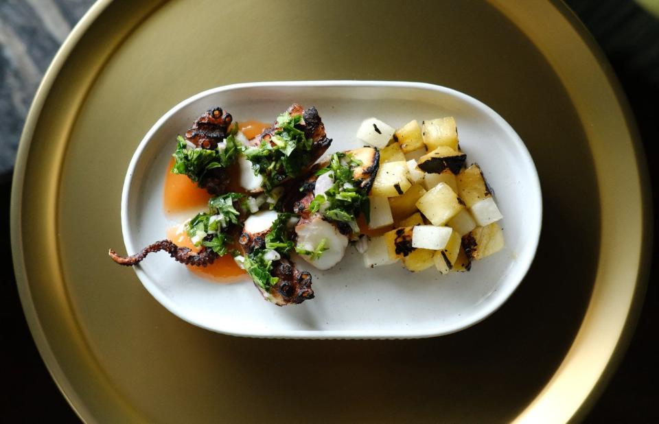 Among the small-plates dishes offered at 24 Main in New Albany is grilled octopus with jicama and pineapple.