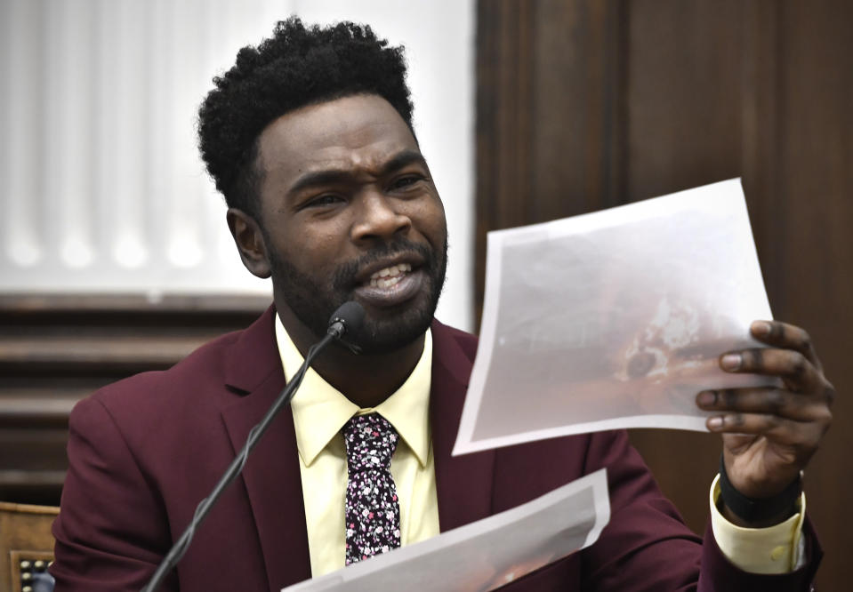 Koerri Washington says he recognizes a photograph of a garbage truck on fire while testifying during Kyle Rittenhouse's trial at the Kenosha County Courthouse in Kenosha, Wis., on Wednesday, Nov. 3, 2021. Rittenhouse is accused of killing two people and wounding a third during a protest over police brutality in Kenosha, last year. (Sean Krajacic/The Kenosha News via AP, Pool)