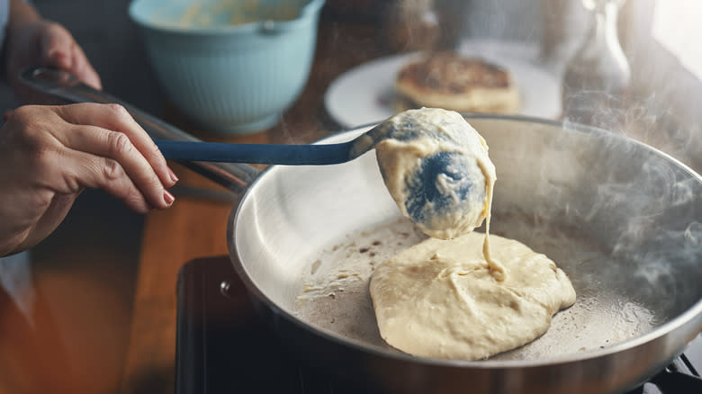Person pouring batter in skillet