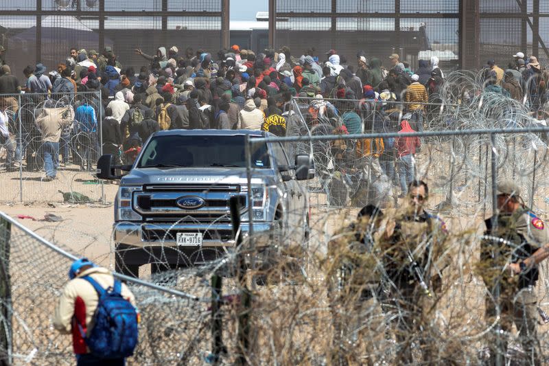 Migrants cross into the U.S. as seen from Ciudad Juarez