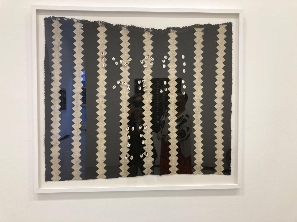 An artwork by artist and activist Patrisse Cullors, made of vintage African mudcloth, yarn and cowrie shells, is displayed at the exhibit "Freedom Portals" at the Charlie James Gallery in Chinatown, Los Angeles, on March 14, 2023.