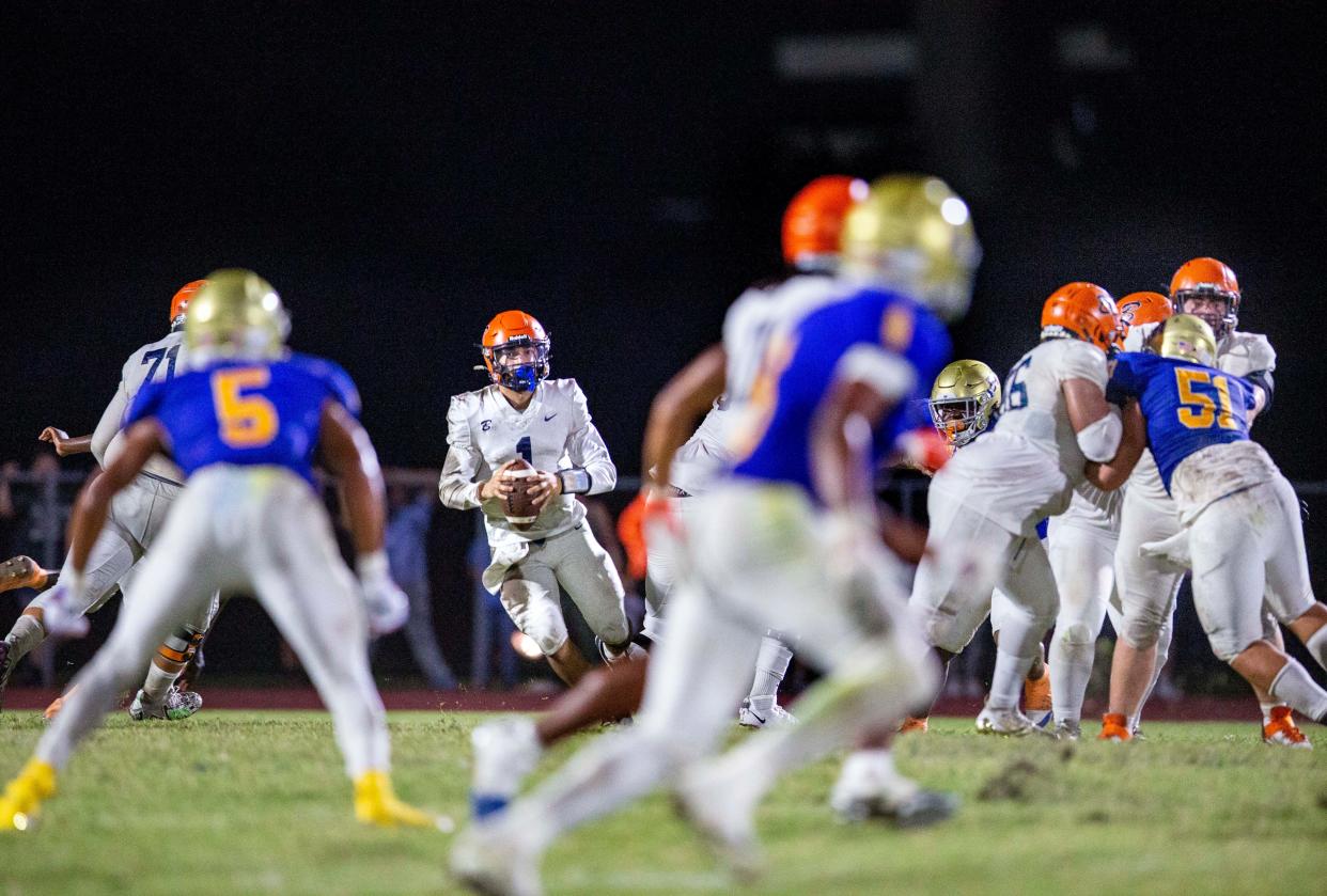 Benjamin quarterback Jayden Vega looks for an open receiver against Cardinal Newman during their football game on October 20, 2023 in West Palm Beach, Florida.