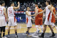 Japan's Yuki Togashi, center, and his teammates greet after their FIBA Basketball World Cup 2023 Asian Qualifiers Group B match against China, Saturday, Nov. 27, 2021, in Sendai, northeastern Japan. The East Asia Super League is set to launch next October featuring some of the region’s biggest domestic clubs. It’s banking on Asia’s home-grown talent to grow from an invitational event to the world’s third-biggest basketball league. One is the so-called Golden Boy of the Philippines. Another is the first 100 million-yen-a-season basketball player in Japan, Togashi. (AP Photo/Eugene Hoshiko)