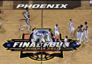 <p>North Carolina players celebrate after the finals of the Final Four NCAA college basketball tournament against Gonzaga, Monday, April 3, 2017, in Glendale, Ariz. North Carolina won 71-65. (AP Photo/Morry Gash) </p>