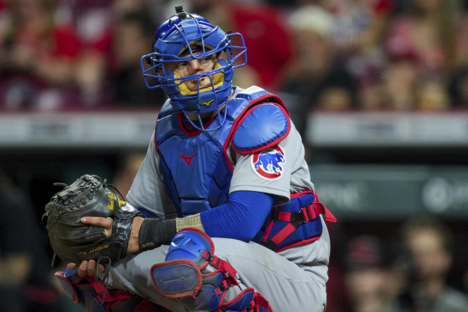 FILE - Chicago Cubs catcher Yan Gomes plays his position during the second game of a baseball doubleheader against the Cincinnati Reds in Cincinnati, Sept. 1, 2023. Pitcher Kyle Hendricks' $16 million option for 2024 was exercised Sunday, Nov. 5, 2023, by the Cubs, who also exercised a $6 million option on Gomes. (AP Photo/Aaron Doster, File)