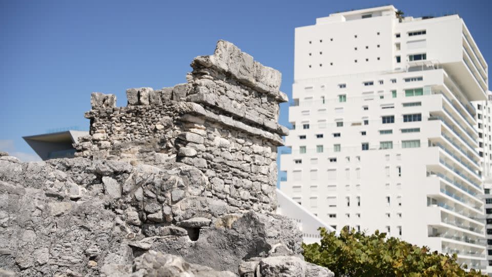 Modern hotels stand next to ancient ruins in Cancun. - CNN