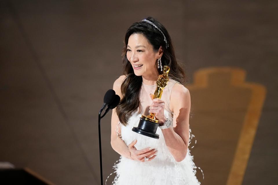"Everything Everywhere All at Once" star Michelle Yeoh accepts the award for best actress on March 12, 2023.
