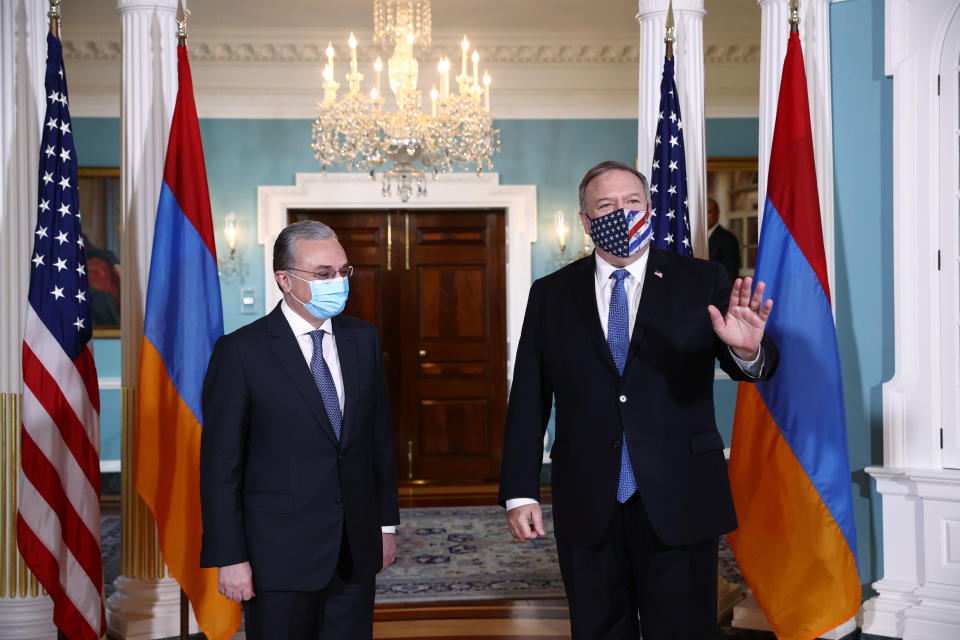 Secretary of State Mike Pompeo stands with Armenia Foreign Minister Zohrab Mnatsakanyan at the State Department, Friday Oct. 23, 2020, in Washington. (Hannah McKay/Pool via AP)
