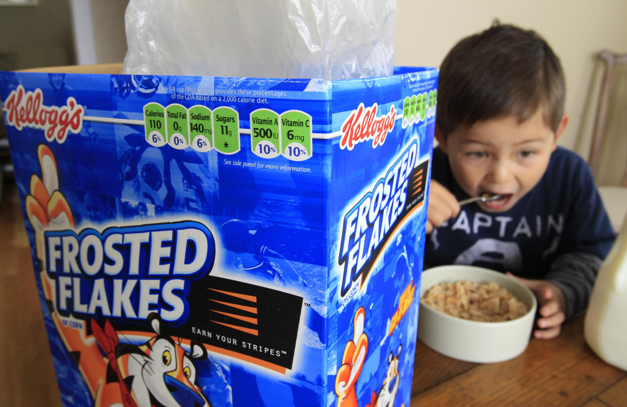 A 4-year-old eats Kellogg's Frosted Flakes cereal at his home.