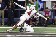 Texas A&M wide receiver Evan Stewart (1) catches a pass for a touchdown as Arkansas defensive back Malik Chavis (4) defends during the first half of an NCAA college football game Saturday, Sept. 24, 2022, in Arlington, Texas. (AP Photo/Brandon Wade)