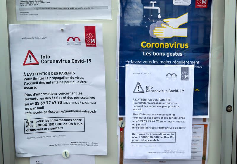 Signs informing parents about school closures are pictured in Mulhouse