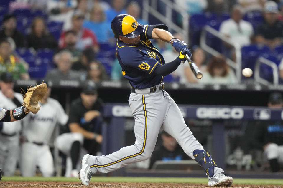 Milwaukee Brewers' Tyrone Taylor hits an RBI single to score Brice Turang during the fifth inning of a baseball game against the Miami Marlins, Sunday, Sept. 24, 2023, in Miami. (AP Photo/Lynne Sladky)