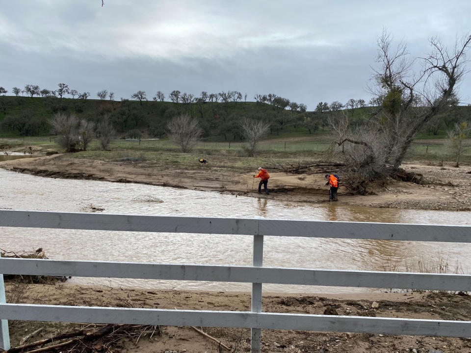 In this photo provided by San Luis Obispo County Sheriff's Office, rescuers resume their search on Wednesday, Jan. 11, 2023, for 5-year-old Kyle Doan, who was swept away Monday, Jan. 9, by floodwaters near San Miguel, Calif. (San Luis Obispo County Sheriff's Office via AP)