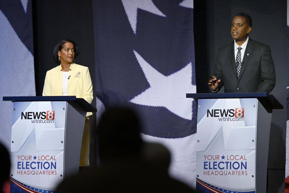 Republican U.S. House candidate George Logan, right, speaks during a debate against Rep. Jahana Hayes, D-Conn., Tuesday, Oct. 18, 2022, in Waterbury, Conn. (AP Photo/Jessica Hill)