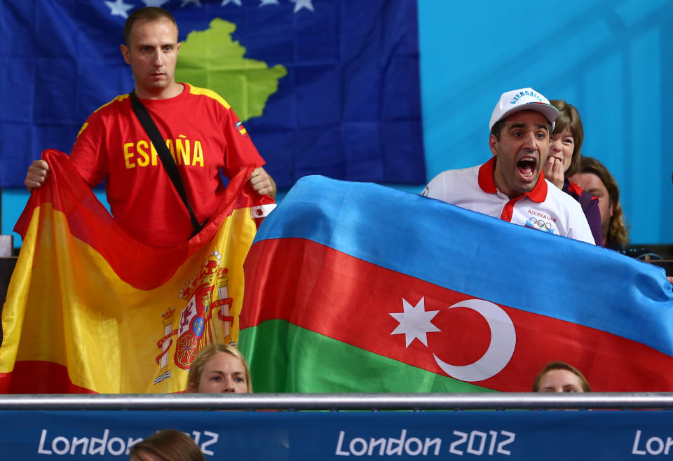 LONDON, ENGLAND - JULY 29: Fans wave flags in the Men's -66 kg Judo on Day 1 of the London 2012 Olympic Games at ExCeL on July 29, 2012 in London, England. (Photo by Michael Steele/Getty Images)