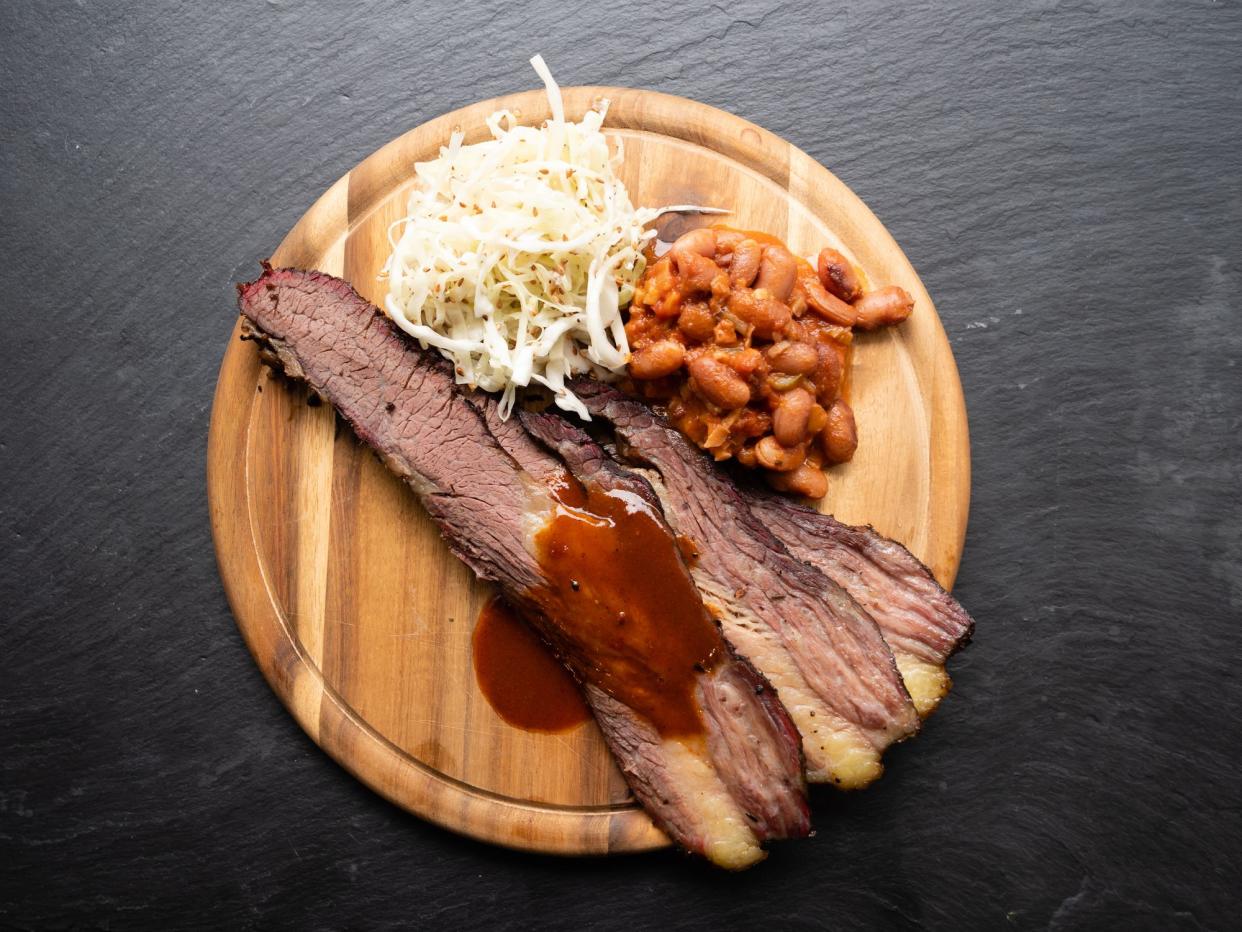 BBQ Brisket in Texas Style with Pinto Beans, Coleslaw and Red Sauce Top View