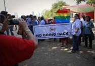 Gay rights activists pose for pictures at a protest organised against the Supreme Court's order on gay sex in Mumbai December 11, 2013. India's Supreme Court on Wednesday threw out a 2009 ruling by a lower court that had decriminalised gay sex, in a major blow to gay rights in the world's largest democracy. (REUTERS/Danish Siddiqui)