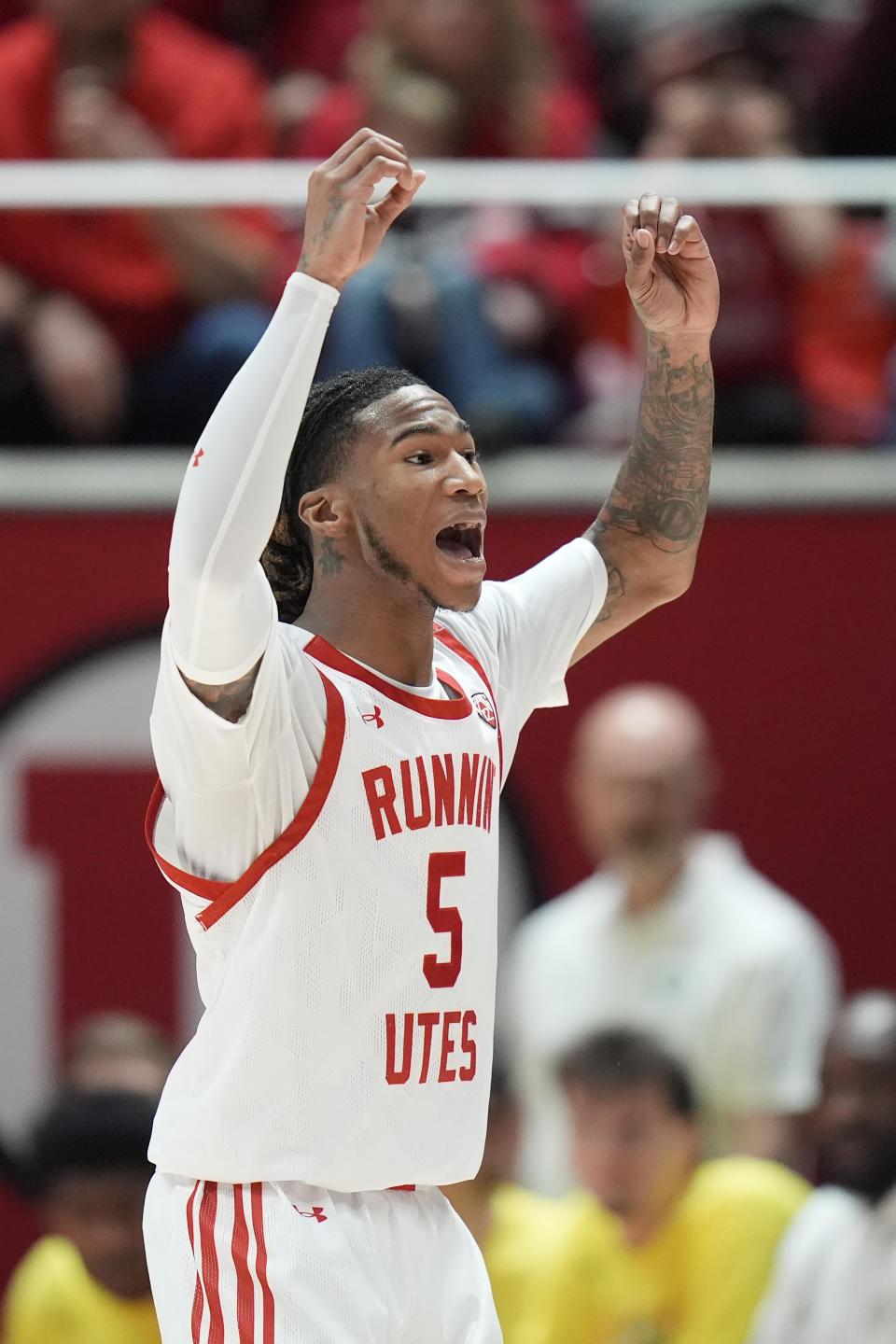 Utah guard Deivon Smith reacts during the first half of an NCAA college basketball game against Oregon, Sunday, Jan. 21, 2024, in Salt Lake City. (AP Photo/Rick Bowmer)