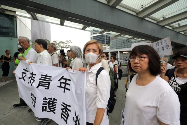 Deanie Ip, centre, joins protesters