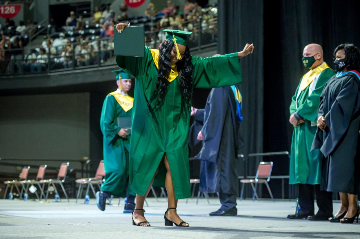 An Acadiana High graduate in the class of 2021 celebrates across the stage of the Cajundome in Lafayette. See the full schedule for this year's Lafayette Parish high school ceremonies.