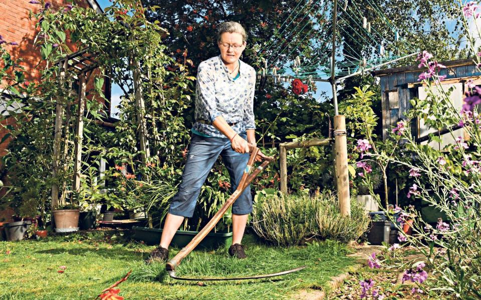 'It’s no more dangerous than using secateurs badly. It just looks scary' says Andi Rickard, UK scything champion - RUSSELL SACH