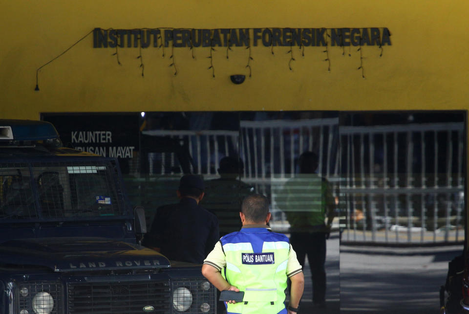 FILE PHOTO: A police officer stands at the morgue at Kuala Lumpur General Hospital where Kim Jong Nam's body is held for autopsy in Malaysia February 18, 2017. REUTERS/Athit Perawongmetha/File Photo