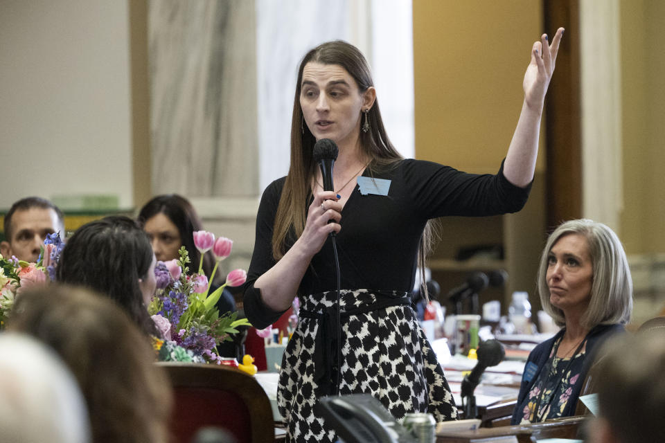 Zooey Zephyr speaks on the House floor for the first time in a week during a session at the Montana State Capitol in Helena, Mont., on Wednesday, April 26, 2023. Lawmakers and courts are wrestling with whether to ban gender-affirming care for minors in some states, while lawmakers in others are protecting access. (AP Photo/Tommy Martino)