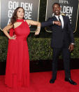 <p>Salma Hayek and Sterling K. Brown bump elbows on the Golden Globes red carpet on Sunday at The Beverly Hilton.</p>