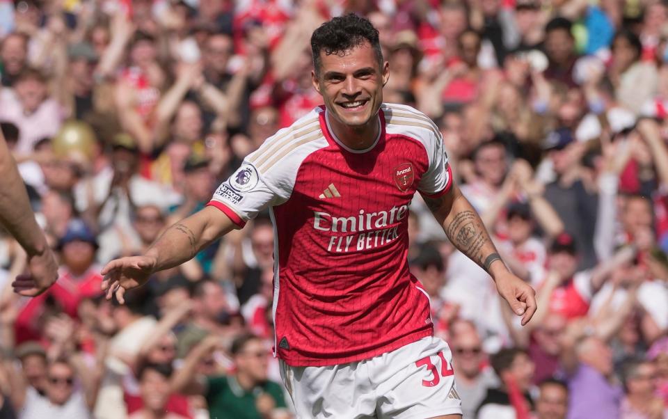 Arsenal's Granit Xhaka celebrates after scoring his side's opening goal during the English Premier League soccer match between Arsenal and Wolverhampton Wanderers at the Emirates Stadium in London - AP Photo/Kin Cheung