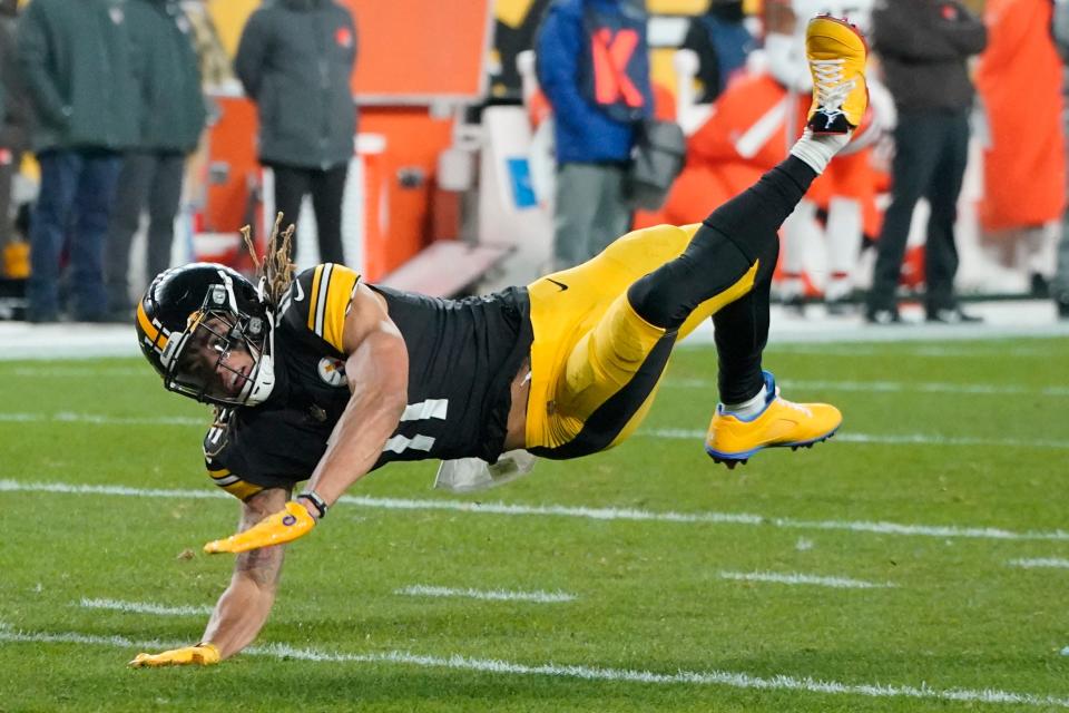 Pittsburgh Steelers wide receiver Chase Claypool (11) twirls to the ground after missing a diving catch attempt against the Cleveland Browns during the first half an NFL football game, Monday, Jan. 3, 2022, in Pittsburgh. (AP Photo/Gene J. Puskar)