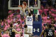 Seton Hall forward Sandro Mamukelashvili (23) dunks with Butler forward Sean McDermott (22) and other defenders watching during the first half of an NCAA college basketball game Wednesday, Feb. 19, 2020, in Newark, N.J. (AP Photo/Kathy Willens)