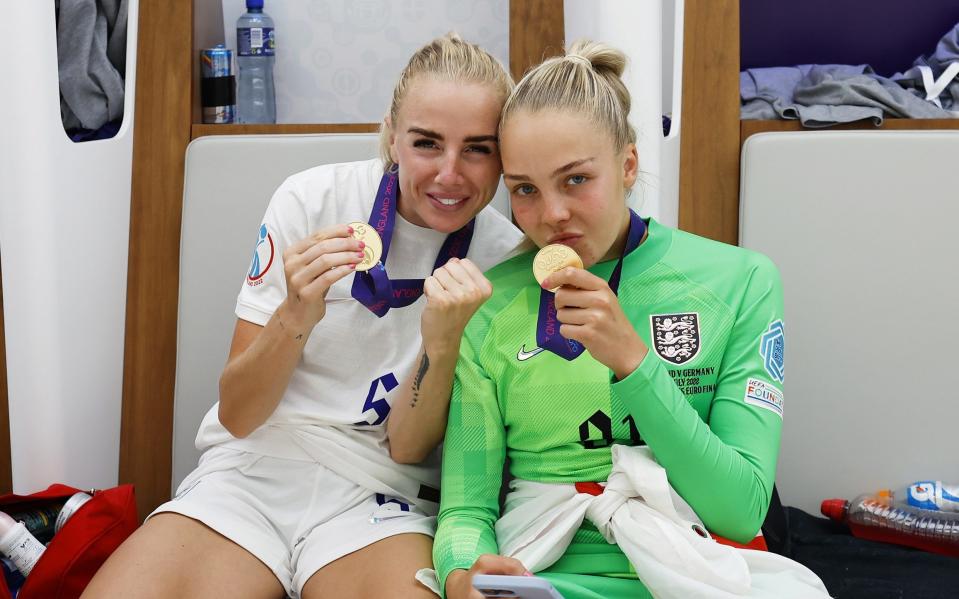 Alex Greenwood and Ellie Roebuck of England celebrate with their winners medals following victory in the UEFA Women's Euro 2022 final match between England and Germany at Wembley Stadium on July 31, 2022 in London, England - The FA/The FA via Getty Images