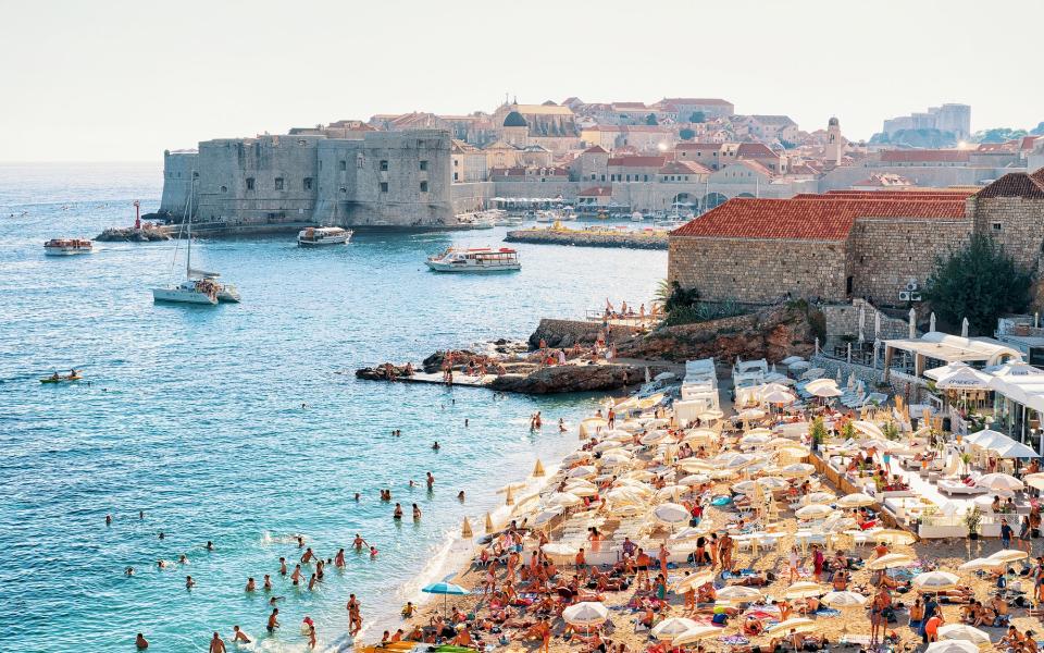 Spend the afternoon sunbathing and swimming in the deep blue Adriatic at Banje beach