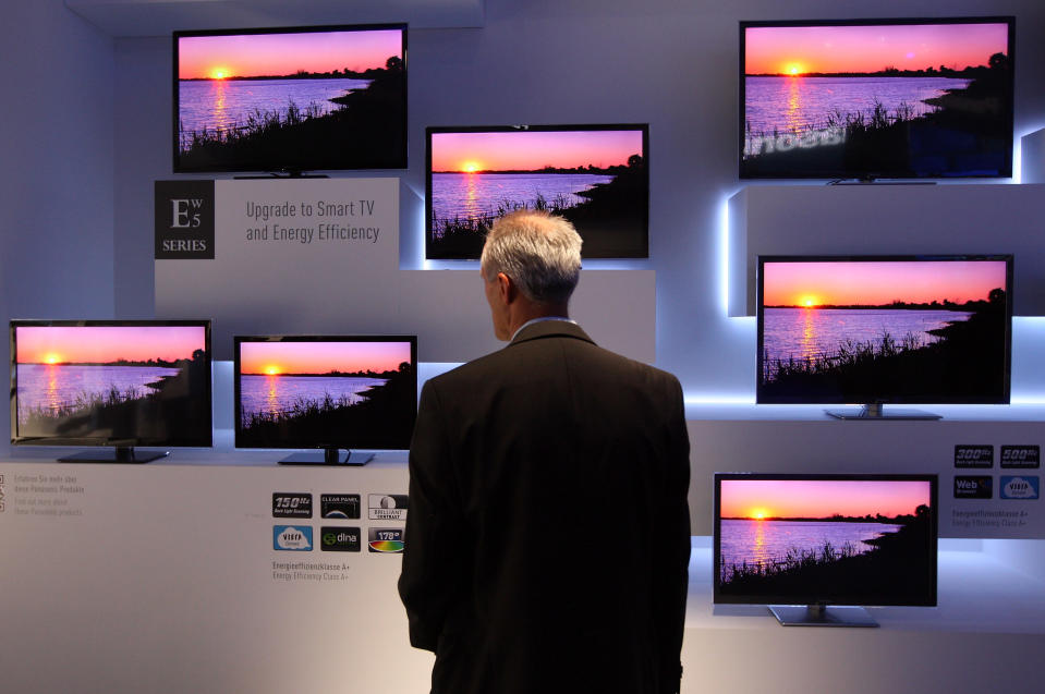 BERLIN, GERMANY - AUGUST 31: A visitor looks at Panasonic ETW5 energy efficient Smart TV flat-screen televisions at the Internationale Funkausstellung (IFA) 2012 consumer electronics trade fair on August 31, 2012 in Berlin, Germany. IFA 2012 is open to the public from today until September 5. (Photo by Adam Berry/Getty Images)
