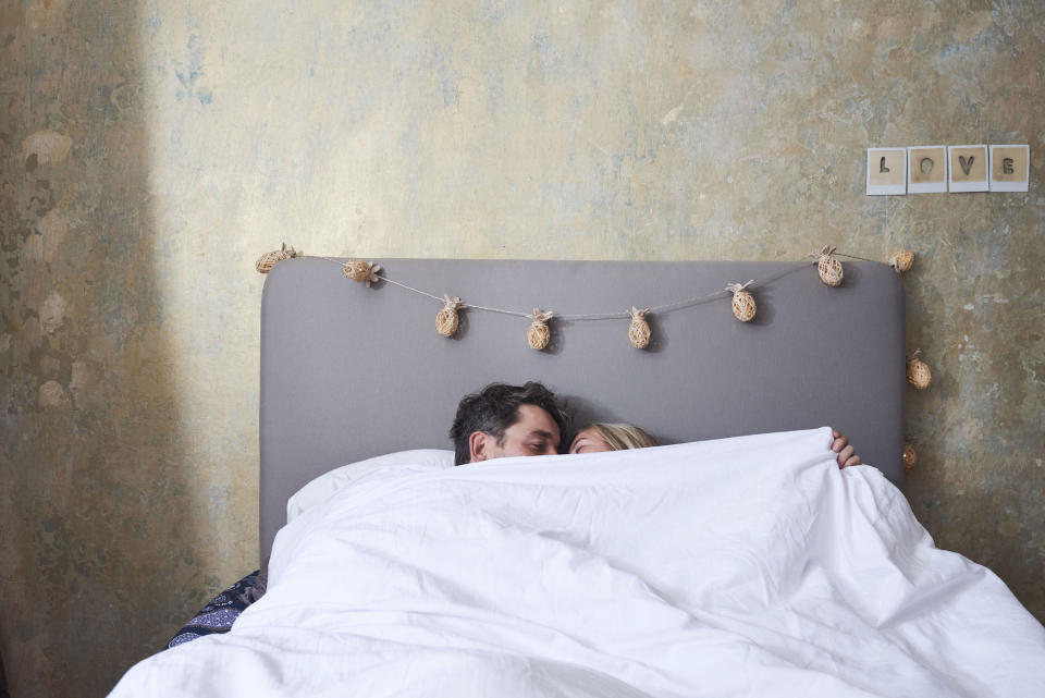 Couple in bed. (Getty Images)