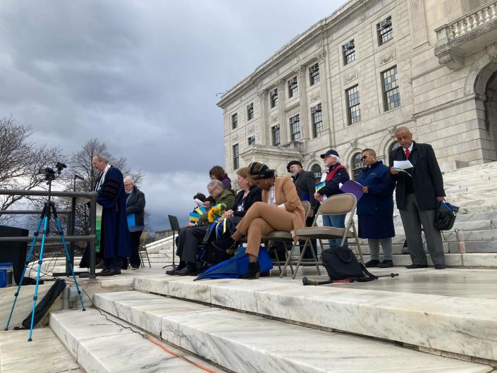 Community, government and religious leaders speak on the State House steps at Saturday&#39;s rally in support of Ukraine.