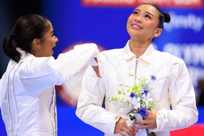 Suni Lee (right) reacts to being named to the Team.<span class="copyright">Nikolas Liepins—Anadolu/Getty Images</span>