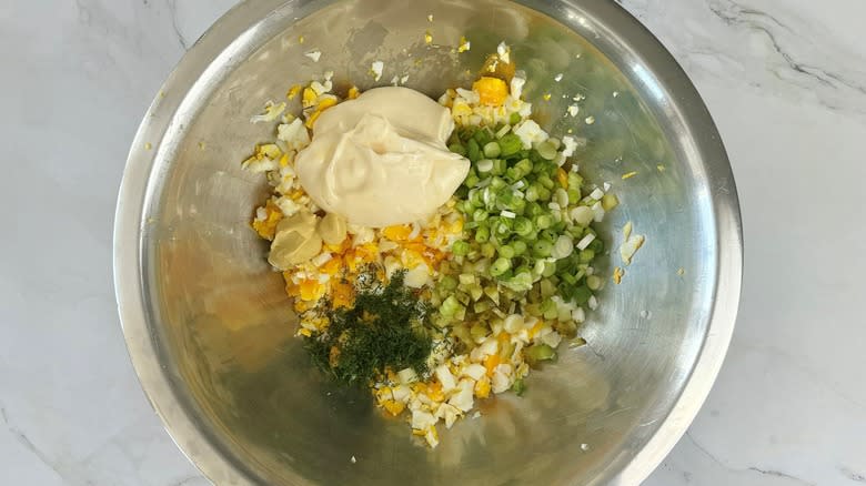 egg salad ingredients in bowl