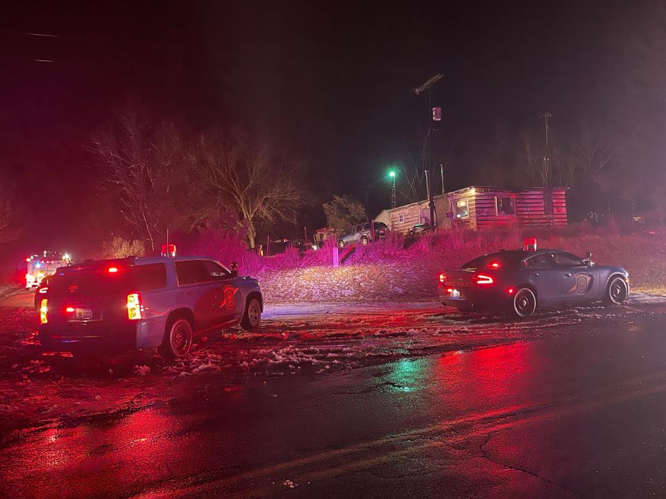 Michigan State Police vehicles surround a home during a barricaded gun situation Tuesday, Jan. 9, in Jefferson Township.