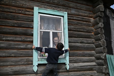 The Wider Image: Russian village's last teacher stays on for her one remaining pupil