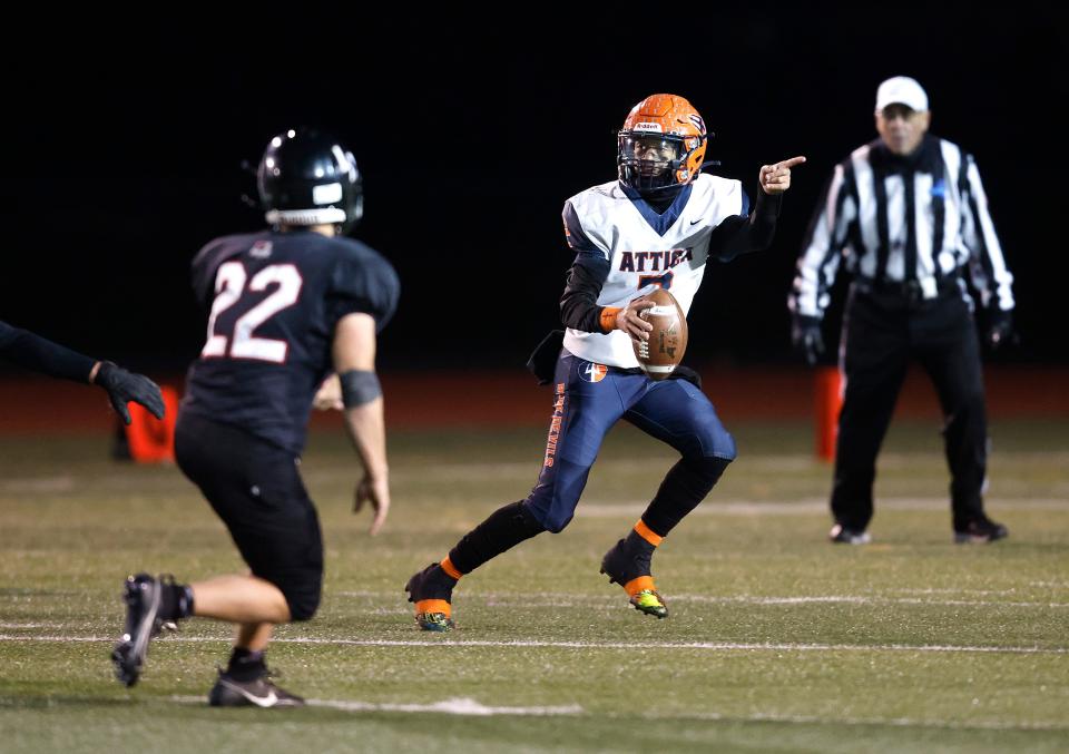 Attica/Alexander quarterback Trent Woods signals his receiver to run towards the sideline.