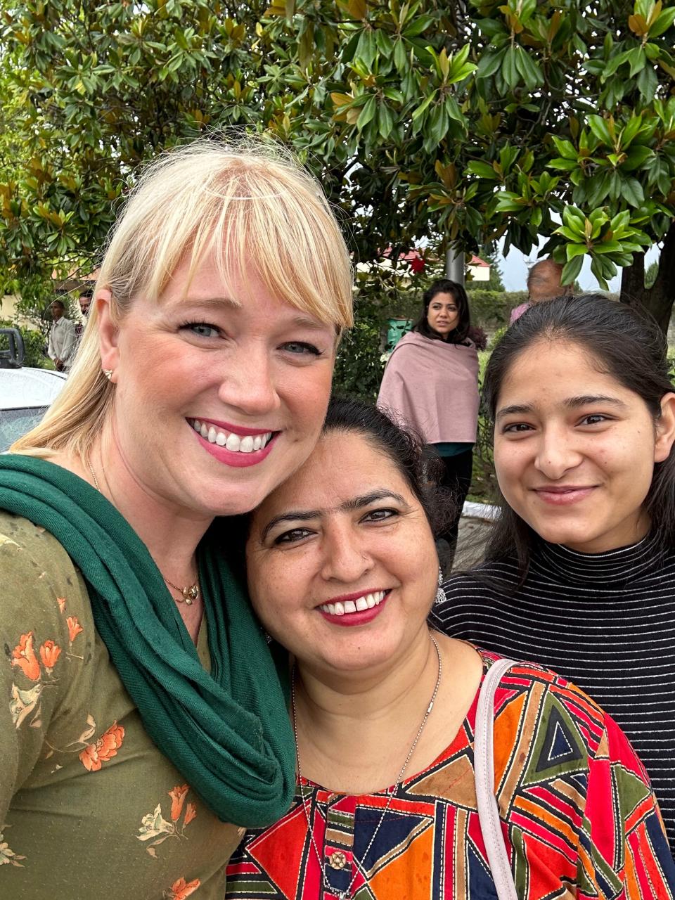 Brittany Curry with Jitender Jeet Kaur, who runs the Women’s Team in Khaniyara, a village near Dharamshala in northern India, and Jitender's neice Anmol Kaur, at the airport in India, 2023.