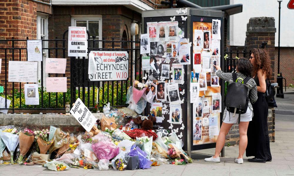 Tributes and missing posters near the site of the Grenfell Tower blaze in west London.