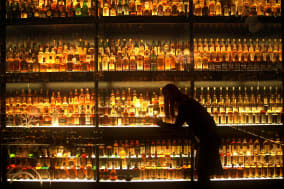 File photo dated 10/03/13 of a member of staff looks at the Diageo Claive Scotch Whisky collection the worlds largest collection of Scotch whisky as Scotch whisky producers will be required to sign up to a new verification scheme if they want to sell their products within the European Union (EU). PRESS ASSOCIATION Photo. Issue date: Friday January 10, 2014. The Spirit Drinks Verification Scheme, set up by the UK Government, will help consumers in the UK and abroad to differentiate from genuine UK-produced spirits and fake or sub-standard competitors. Scotch Whisky will be the first major spirit to be protected, with other UK drinks with a geographical origin, such as Somerset Cider Brandy and Irish Whiskey produced in Northern Ireland, to follow later. See PA story POLITICS Spirits. Photo credit should read: David Cheskin/PA Wire