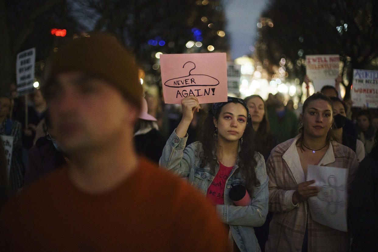 Demonstrators in Providence, R.I., gather on Tuesday to protest the news that the U.S. Supreme Court could be poised to overturn the landmark Roe v. Wade case that legalized abortion nationwide. (David Goldman/AP Photo)